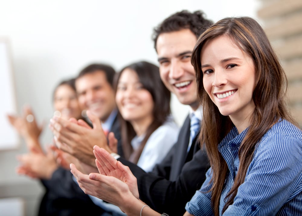 business team clapping a good presentation in an office